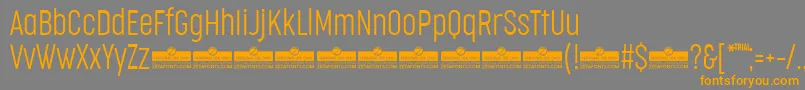 CocogooseCompressedUltralightTrial-Schriftart – Orangefarbene Schriften auf grauem Hintergrund