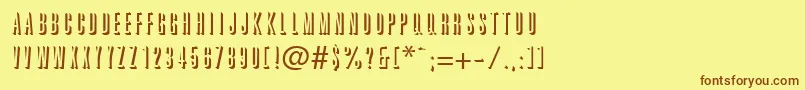 フォントGraphiteshadowRegularDb – 茶色の文字が黄色の背景にあります。