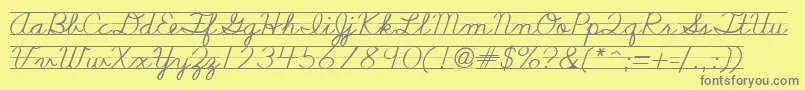 Nealcurieruledsh-Schriftart – Graue Schriften auf gelbem Hintergrund