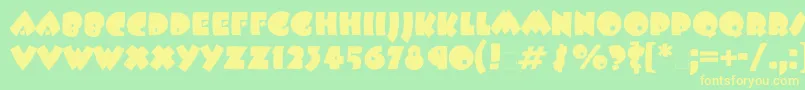 Beeskneesgtt Font – Yellow Fonts on Green Background