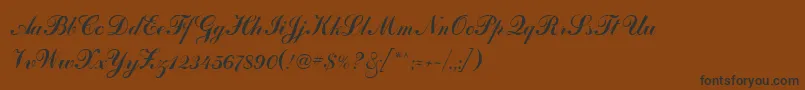 フォントArtscriptRegular – 黒い文字が茶色の背景にあります