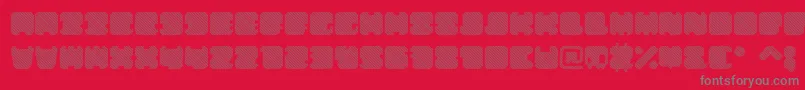 ShdTechnotypeItalic-fontti – harmaat kirjasimet punaisella taustalla