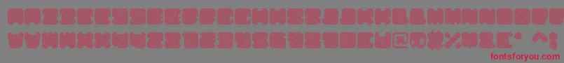 ShdTechnotypeItalic-fontti – punaiset fontit harmaalla taustalla