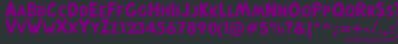 Czcionka TintinMajusculesBold – fioletowe czcionki na czarnym tle