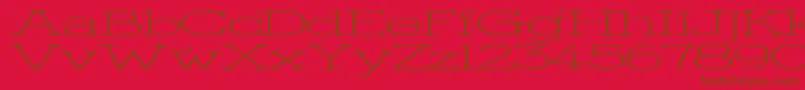 KingthingsSerifiqueUlWide-Schriftart – Braune Schriften auf rotem Hintergrund