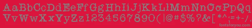 フォントSnobhandscript – 赤い背景に灰色の文字