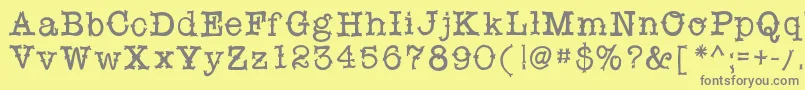フォントSnobhandscript – 黄色の背景に灰色の文字