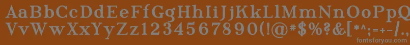 Phosph10-fontti – harmaat kirjasimet ruskealla taustalla
