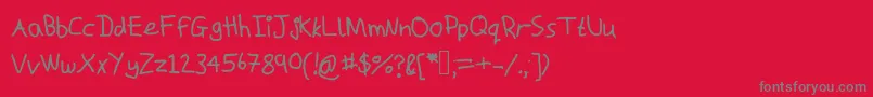 Macs-fontti – harmaat kirjasimet punaisella taustalla