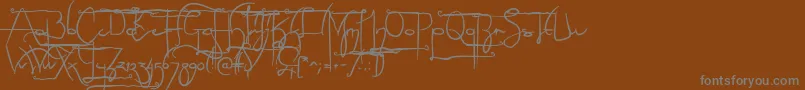 NoLicenseSculptorshandAlternatives-Schriftart – Graue Schriften auf braunem Hintergrund