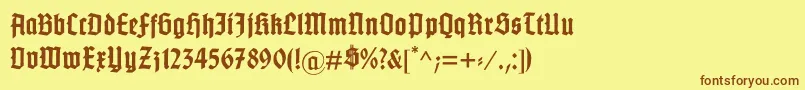 フォントGotenburgB – 茶色の文字が黄色の背景にあります。