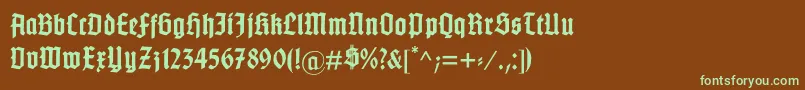 フォントGotenburgB – 緑色の文字が茶色の背景にあります。