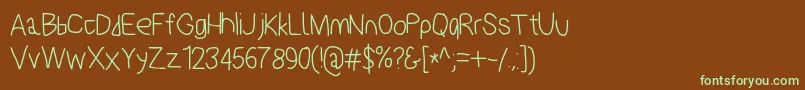 フォントPolanstronk – 緑色の文字が茶色の背景にあります。