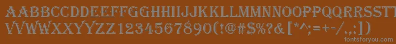 Algeriand-fontti – harmaat kirjasimet ruskealla taustalla