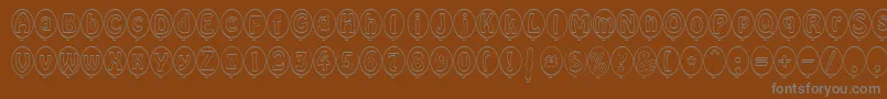 SpBallonBoldDb Font – Gray Fonts on Brown Background