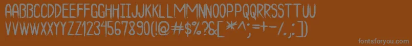 Шрифт TheBadTimesSt – серые шрифты на коричневом фоне