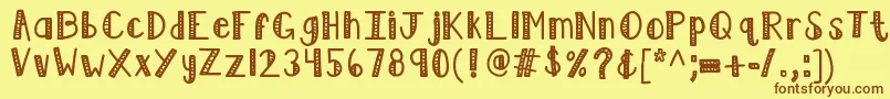 Kblimelight-Schriftart – Braune Schriften auf gelbem Hintergrund