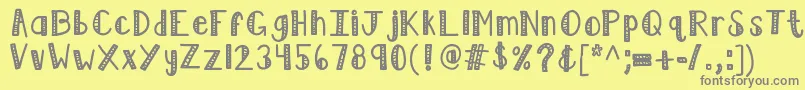 Kblimelight-fontti – harmaat kirjasimet keltaisella taustalla