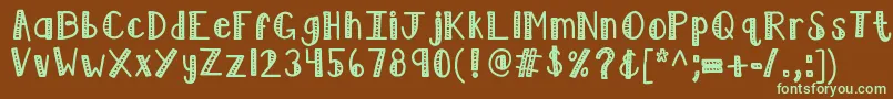 フォントKblimelight – 緑色の文字が茶色の背景にあります。
