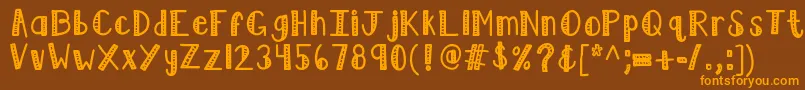 フォントKblimelight – オレンジ色の文字が茶色の背景にあります。
