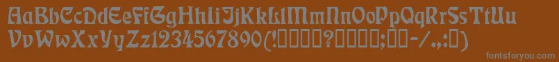 Rudelsberg-fontti – harmaat kirjasimet ruskealla taustalla