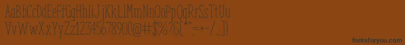 フォントEnyoSlabLight – 黒い文字が茶色の背景にあります