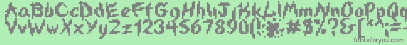 Czcionka Iswasted – szare czcionki na zielonym tle