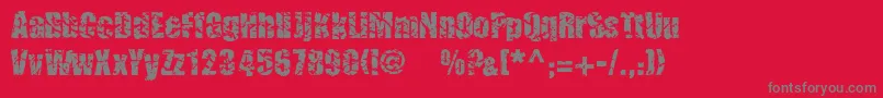 フォントCmcorrug – 赤い背景に灰色の文字