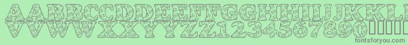 LmsSnailMail-fontti – harmaat kirjasimet vihreällä taustalla