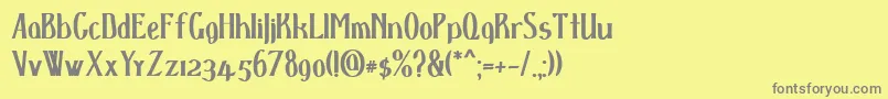 フォントDspenserbold – 黄色の背景に灰色の文字