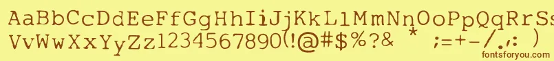 フォントMytype – 茶色の文字が黄色の背景にあります。