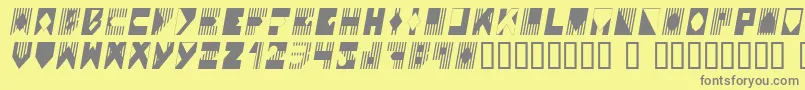 Coloi-fontti – harmaat kirjasimet keltaisella taustalla