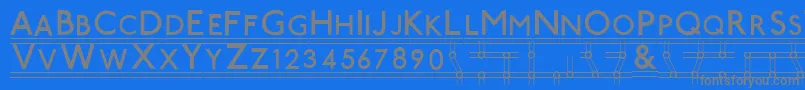 フォントTubestnp – 青い背景に灰色の文字