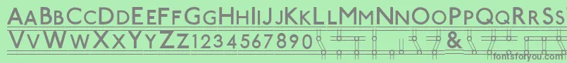 フォントTubestnp – 緑の背景に灰色の文字