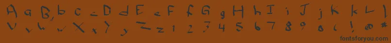Qwikscribble-Schriftart – Schwarze Schriften auf braunem Hintergrund