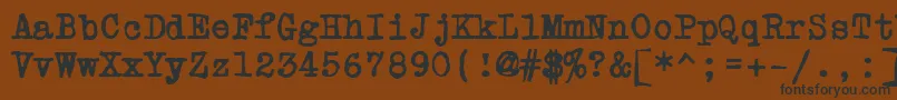 フォントPowderfingerType – 黒い文字が茶色の背景にあります