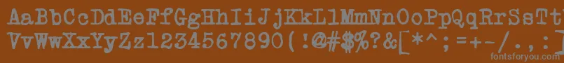 Fonte PowderfingerType – fontes cinzas em um fundo marrom