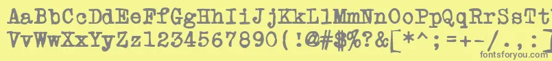 PowderfingerType-fontti – harmaat kirjasimet keltaisella taustalla