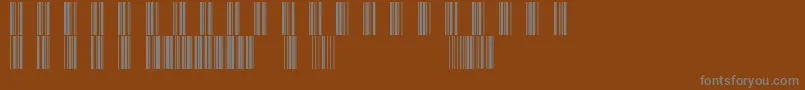 Barcod39-fontti – harmaat kirjasimet ruskealla taustalla