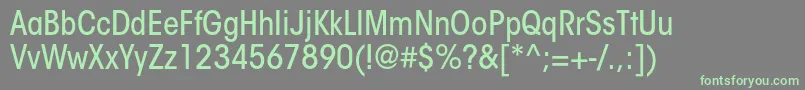 フォントItcavantgardestdMdcn – 灰色の背景に緑のフォント