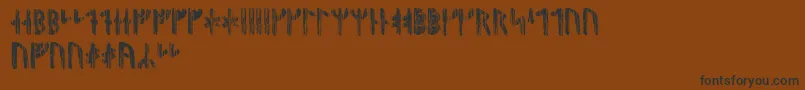 Nidhoggrunic-fontti – mustat fontit ruskealla taustalla