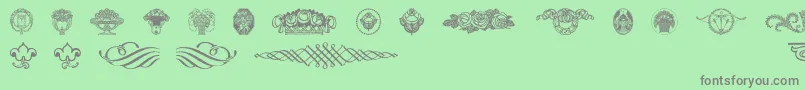 Wieynkfrakturvignetten-Schriftart – Graue Schriften auf grünem Hintergrund