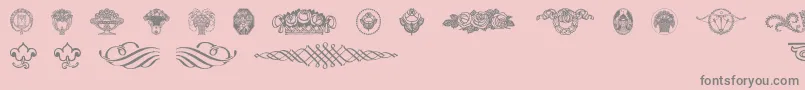 フォントWieynkfrakturvignetten – ピンクの背景に灰色の文字