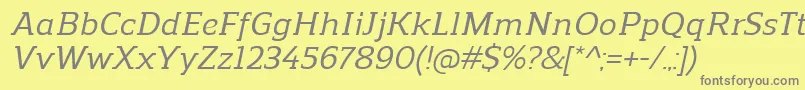 ReganslabMediumitalic-Schriftart – Graue Schriften auf gelbem Hintergrund