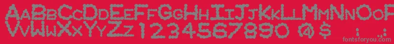 RingwormRegular-Schriftart – Graue Schriften auf rotem Hintergrund