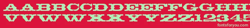 T720DecoRegular-Schriftart – Grüne Schriften auf rotem Hintergrund