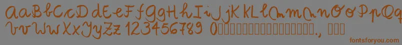 Шрифт Tanaestelbrushscript01Regular – коричневые шрифты на сером фоне