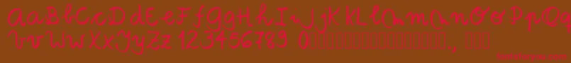 Tanaestelbrushscript01Regular-Schriftart – Rote Schriften auf braunem Hintergrund