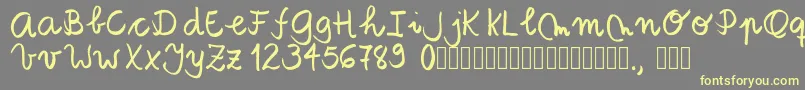 フォントTanaestelbrushscript01Regular – 黄色のフォント、灰色の背景