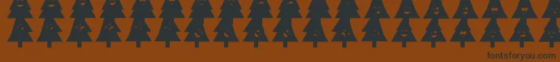 OhChristmasDing-Schriftart – Schwarze Schriften auf braunem Hintergrund